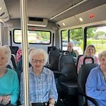 The Arbor at Avamere Court Assisted Senior Living in Keizer, Oregon residents on a transportation bus