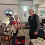 American House Sterling Heights, senior living community offering independent living and respite care in Sterling Heights, MI, residents shaking hands