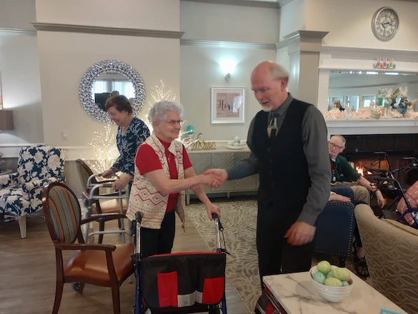 American House Sterling Heights, senior living community offering independent living and respite care in Sterling Heights, MI, residents shaking hands
