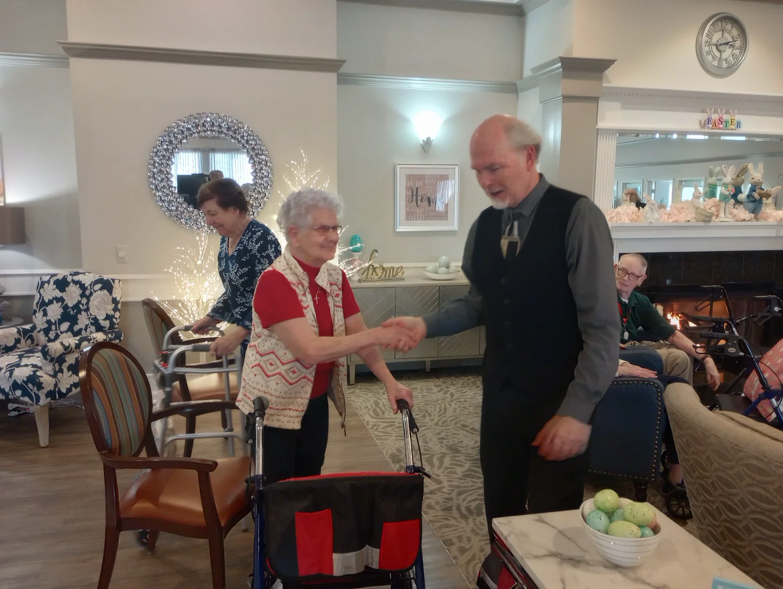 American House Sterling Heights, senior living community offering independent living and respite care in Sterling Heights, MI, residents shaking hands