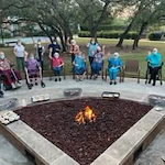 The Oaks Gracious Retirement Living Hawthorn Senior Independent Living in Georgetown, Texas residents sitting by the fire