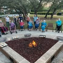 The Oaks Gracious Retirement Living Hawthorn Senior Independent Living in Georgetown, Texas residents sitting by the fire
