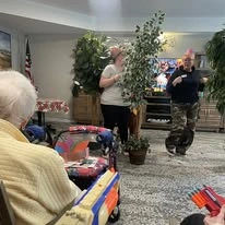 Avamere at Sandy senior living community offering assisted living, memory care, and respite care in Sandy, OR, residents enjoying entertainment