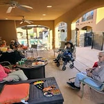 Desert Springs Gracious Retirement Living Hawthorn Senior Independent Living in Oro Valley, Arizona residents socializing outside on the patio