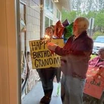 family celebrating Grandma's birthday at Mulligan Park Gracious Retirement Living Hawthorn Senior Independent Living in Tallahassee, Florida