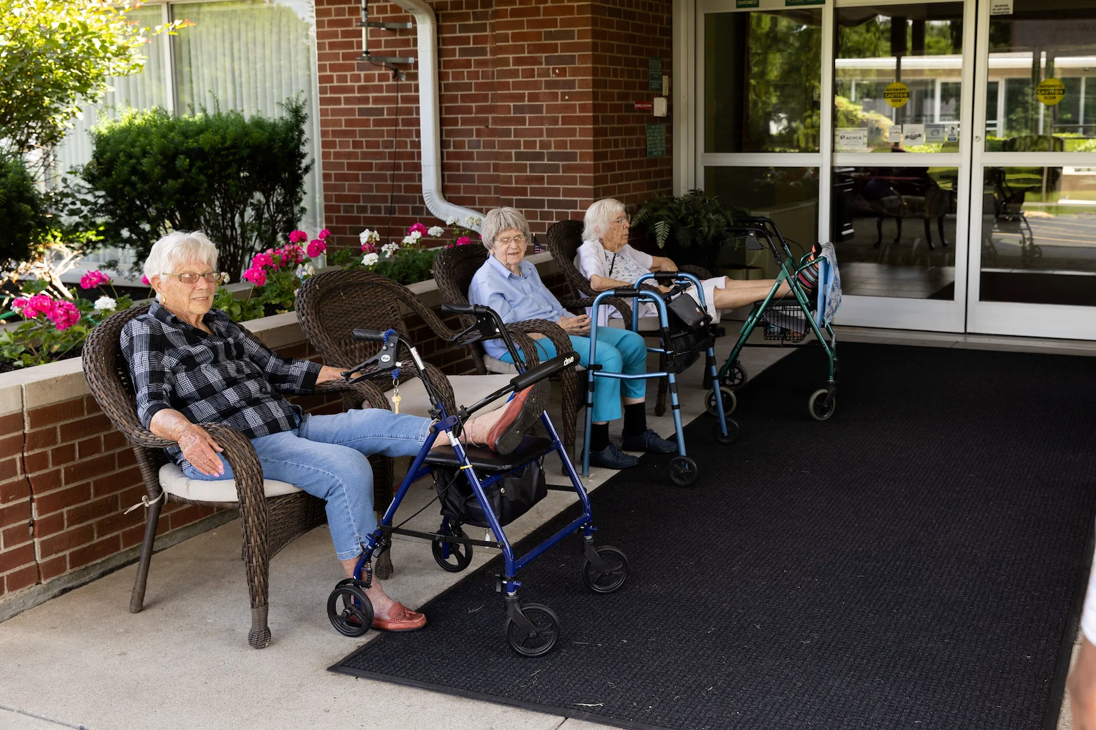 Wesley Manor Assisted Living Community offering assisted living and continuing care retirement community (CCRC) services in Louisville, KY, residents socializing while enjoying time outdoors