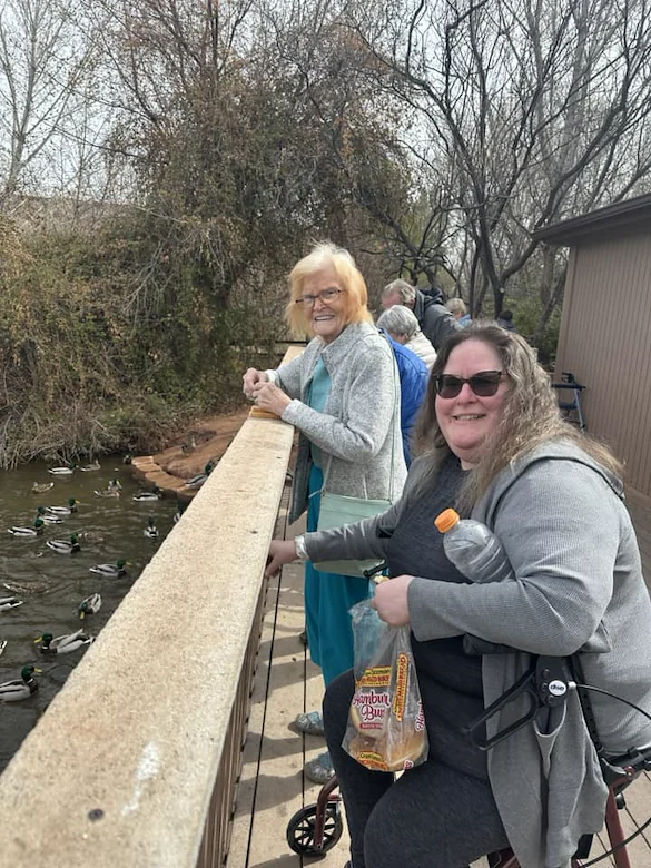 Ridgeview Gardens Assisted Living residents feeding the ducks