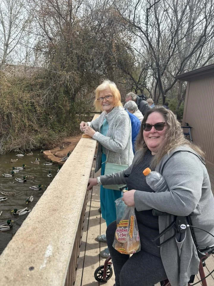 Ridgeview Gardens Assisted Living residents feeding the ducks