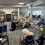Charter Senior Living of Cleveland residents enjoy entertainment from a young magician