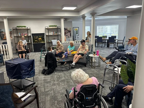 Charter Senior Living of Cleveland residents enjoy entertainment from a young magician