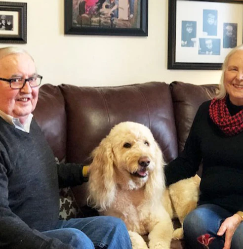 Melrose Meadows residents with a dog