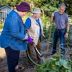 Hillside Senior Living in McMinnville, OR, residents having fun working in the garden