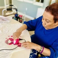 Sonata Coconut Creek senior working on a craft