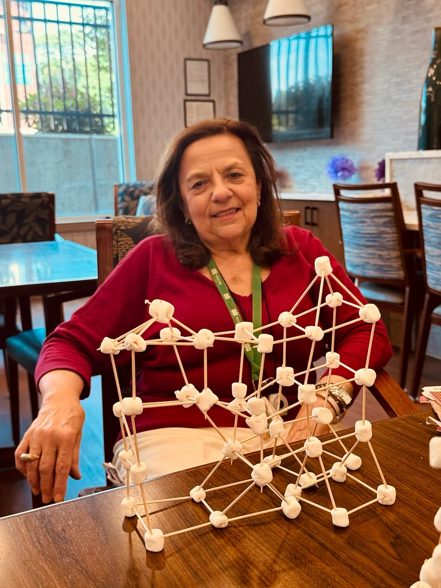 KindCare at Bristol, CT, proud resident with tower creation from engaging activity