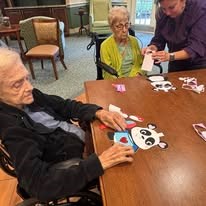 seniors making crafts at Serenades at Longwood