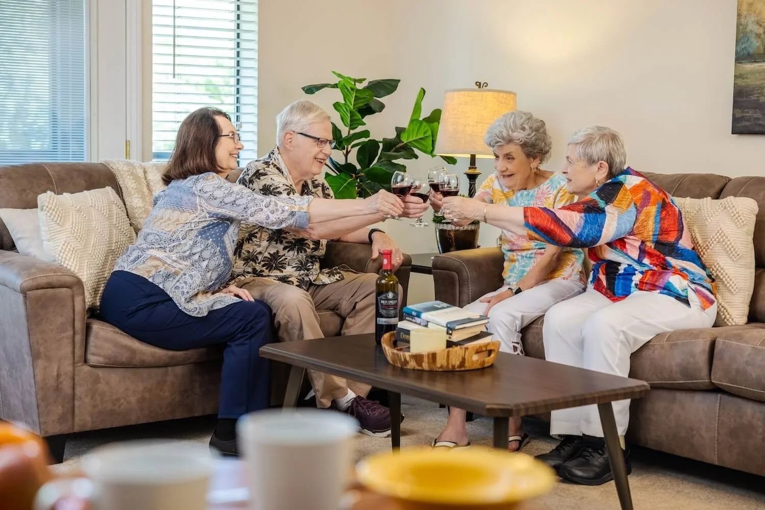 Rosewood Senior Living in Bakersfield, CA, residents visiting and enjoying a glass of wine