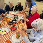 Covenant Living at The Holmstad in Batavia, IL, residents staying engaged through a crafting activity