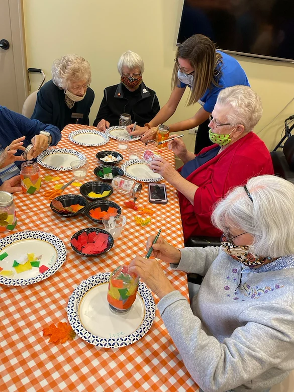 Covenant Living at The Holmstad in Batavia, IL, residents staying engaged through a crafting activity