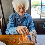 The Knolls Of Oxford resident enjoying a game