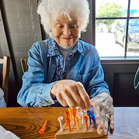 The Knolls Of Oxford resident enjoying a game