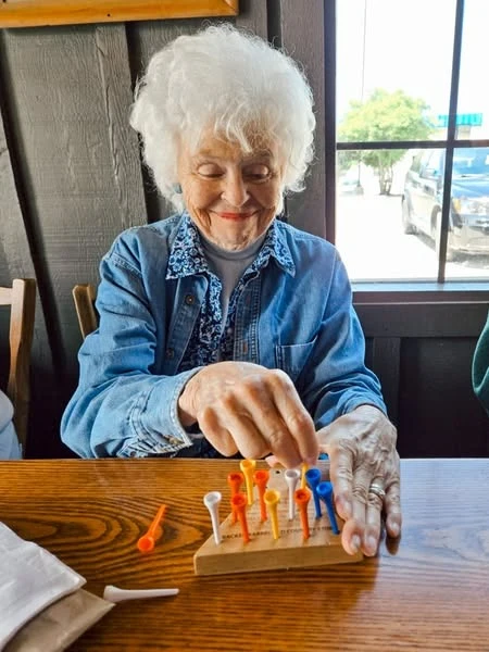 The Knolls Of Oxford resident enjoying a game