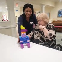 Sonata Coconut Creek seniors building legos together