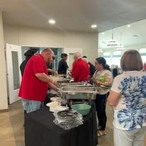 Osprey Heights Gracious Retirement Living Hawthorn Senior Independent Living in Valrico, Florida residents getting food
