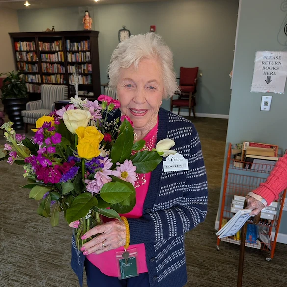 Chateau Bothell Landing in Bothell, WA, resident with floral creation from activity