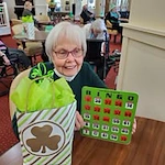 Magnolia Heights Gracious Retirement Living Hawthorn Senior Independent Living in Franklin, Massachusetts resident winning a game of bingo