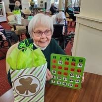 Magnolia Heights Gracious Retirement Living Hawthorn Senior Independent Living in Franklin, Massachusetts resident winning a game of bingo