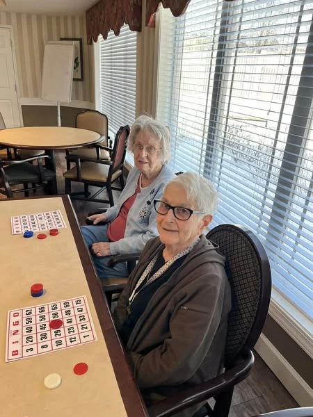 A couple Viva Senior Living residents getting in on playing bingo