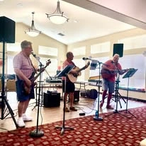 Willow Creek Gracious Retirement Living Hawthorn Senior Independent Living in Chesapeake, Virginia residents performing in a band