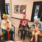 Featherstone at Hickory Hill smiling resident during an activity