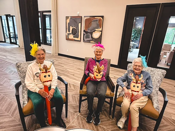 Featherstone at Hickory Hill smiling resident during an activity