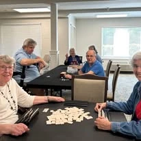 Jordan Oaks Gracious Retirement Living Hawthorn Senior Independent Living in Cary, North Carolina residents playing a game