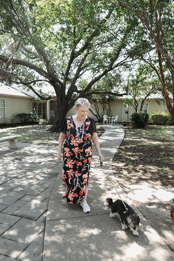 Resident walking dog