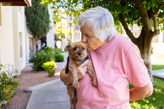 Resident with her dog at Fellowship Square Tucson