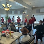 American House Farmington Hills, senior living community offering independent living, assisted living, memory care, and respite care in Farmington Hills, MI, residents enjoying entertaining performers