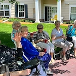 Melrose Meadows residents relaxing and socializing outside