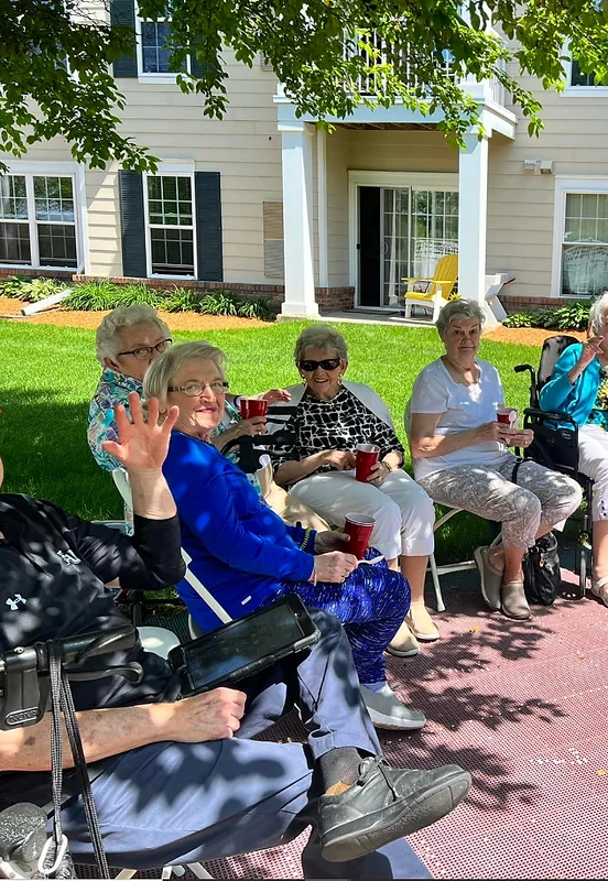 Melrose Meadows residents relaxing and socializing outside