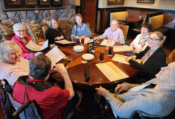 Allisonville Meadows Assisted Living offering assisted living, memory care, and respite care in Fishers, IN, residents eating at a restaurant together