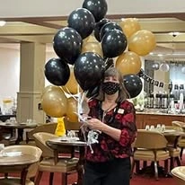 Summerville Estates Gracious Retirement Living Hawthorn Senior Independent Living in Summerville, South Carolina resident holding balloons