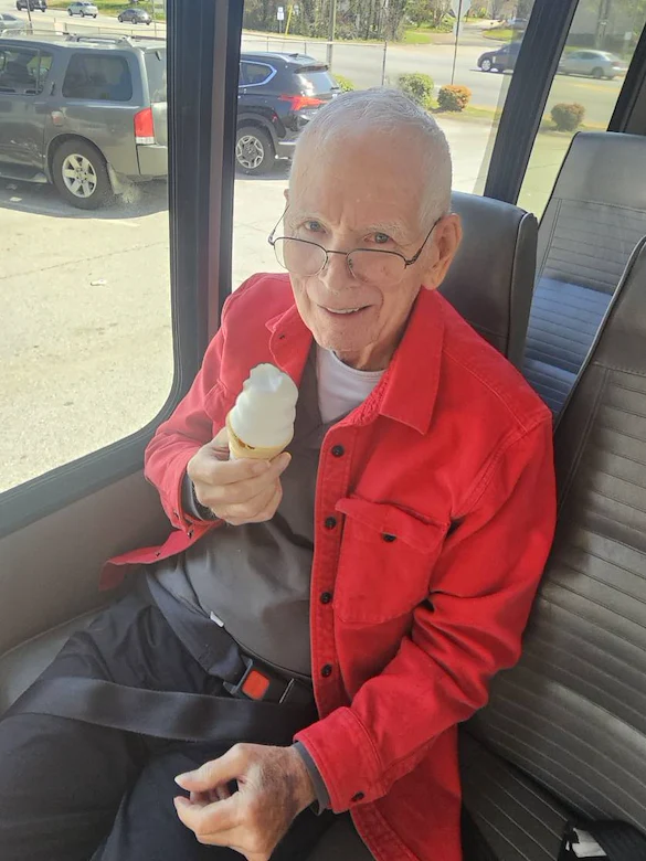 a resident at a community event eating ice cream