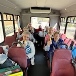 The Lodge at Wake Forest Gracious Retirement Living Hawthorn Senior Independent Living in Wake Forest, North Carolina residents on the transportation bus