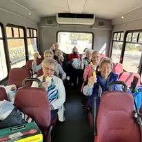 The Lodge at Wake Forest Gracious Retirement Living Hawthorn Senior Independent Living in Wake Forest, North Carolina residents on the transportation bus
