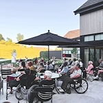 Featherstone at Hickory Hill smiling residents with entertainer