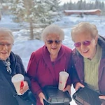 Salmon Creek Gracious Retirement Living Hawthorn Senior Independent Living in Boise, Idaho residents socializing outside in the winter