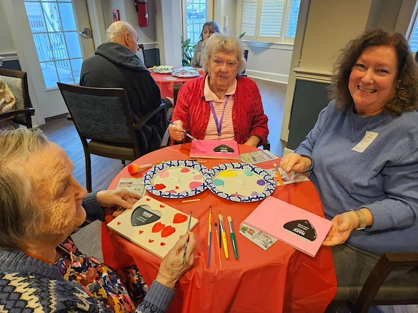Charter Senior Living of Fredericksburg, Virginia, residents enjoying good community and a creative art project