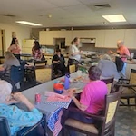 Grande Ronde Retirement Residence senior living community offering independent living, assisted living, and respite care in La Grande, OR, residents enjoying time together in the dining area
