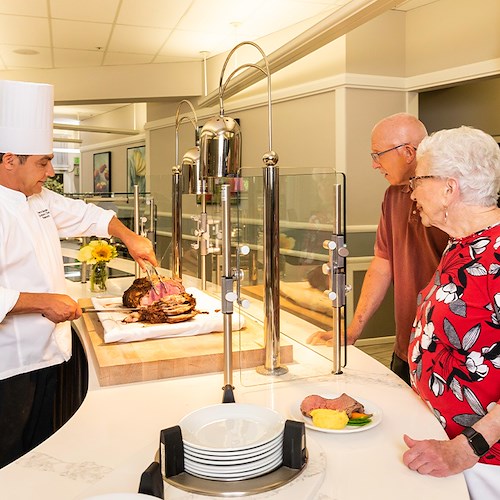 Rosewood Senior Living in Bakersfield, CA, residents having their meals prepared